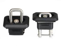 Two black recessed tie-down anchors with stainless steel D-rings and spring mechanisms, shown from the top and side angles against a white background.