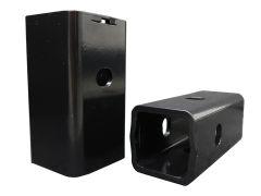 Two black metal hitch receiver reducers.