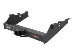 Heavy-duty black trailer hitch with a regular receiver and upward-angle sides, featuring visible mounting points and gold bolts.
Transcribed Text:
CURT COMMERCIAL DUTY