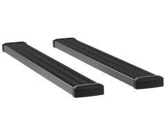 Two black rubberized steps with textured surfaces for improved traction, placed parallel to each other.