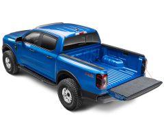 A blue pickup truck with an open cargo bed and "FX4 Off-Road" branding on the side.