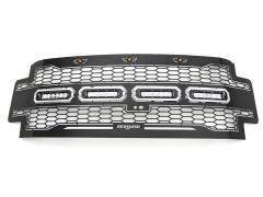 A black automotive grille with a hexagonal mesh design, featuring three rectangular LED lights and amber indicator lights at the top, branded with "REVOLVER."
