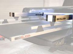 Three metal Bed Slide truck bed slides.