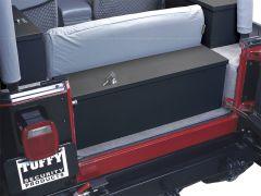 The image shows the rear interior of a red vehicle with a black security lockbox installed behind the backseat. The trunk is open, revealing a clean, organized space.