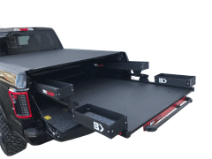 Black truck with sliding storage drawers extended.