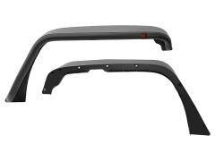 Two black automotive fender flares with an orange  reflector and bolt holes.